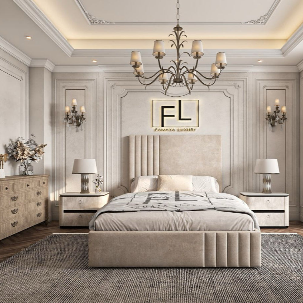 A luxurious bedroom featuring a central Pirelli bed with a tall padded headboard, nightstands with lamps, and an elegant chandelier.