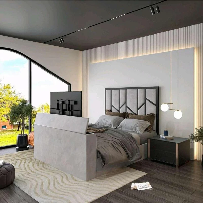 Modern bedroom with a bed with TV at the foot, pendant lights, and large windows.