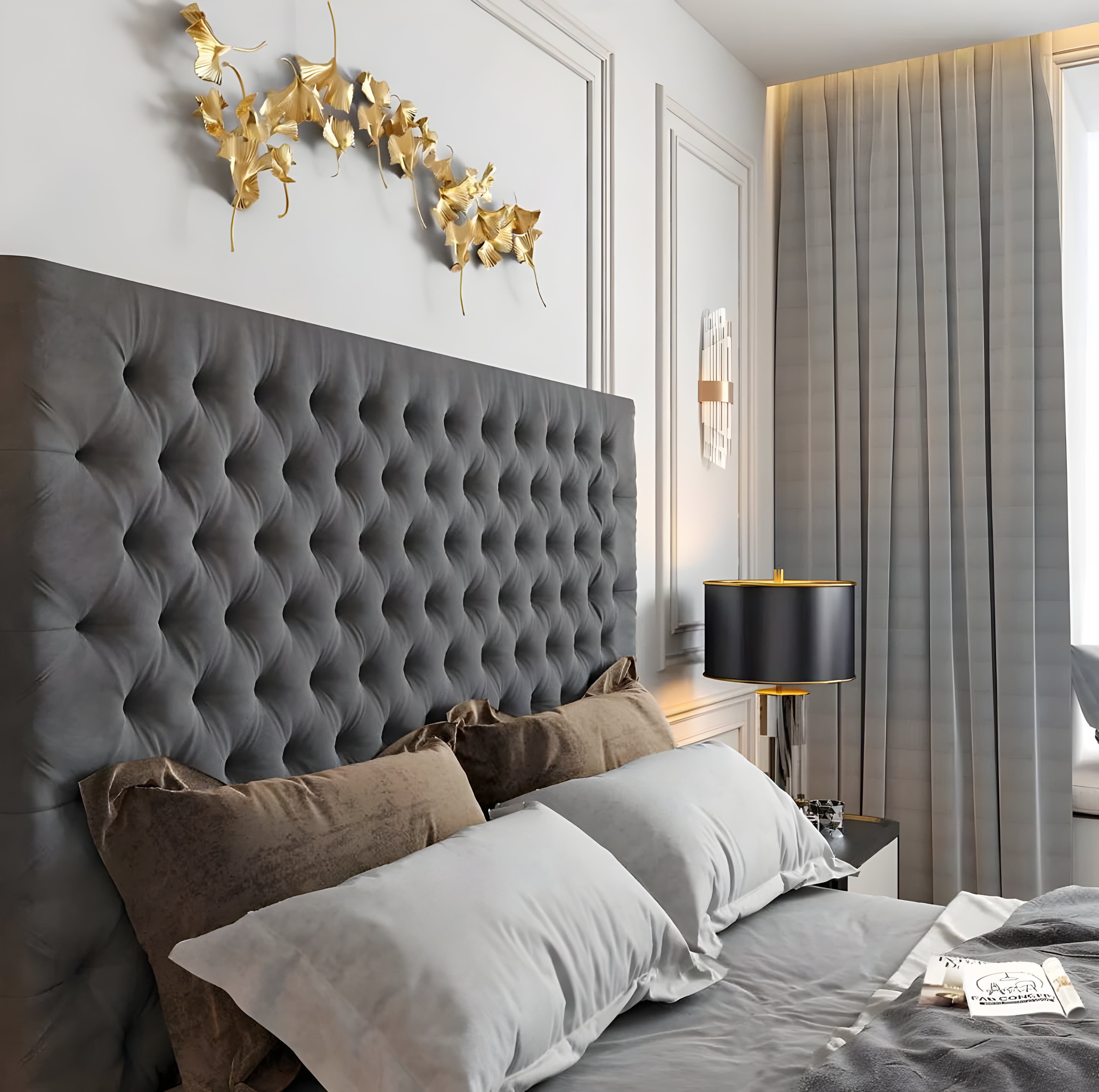 Super king bed headboard and gold wall art above.