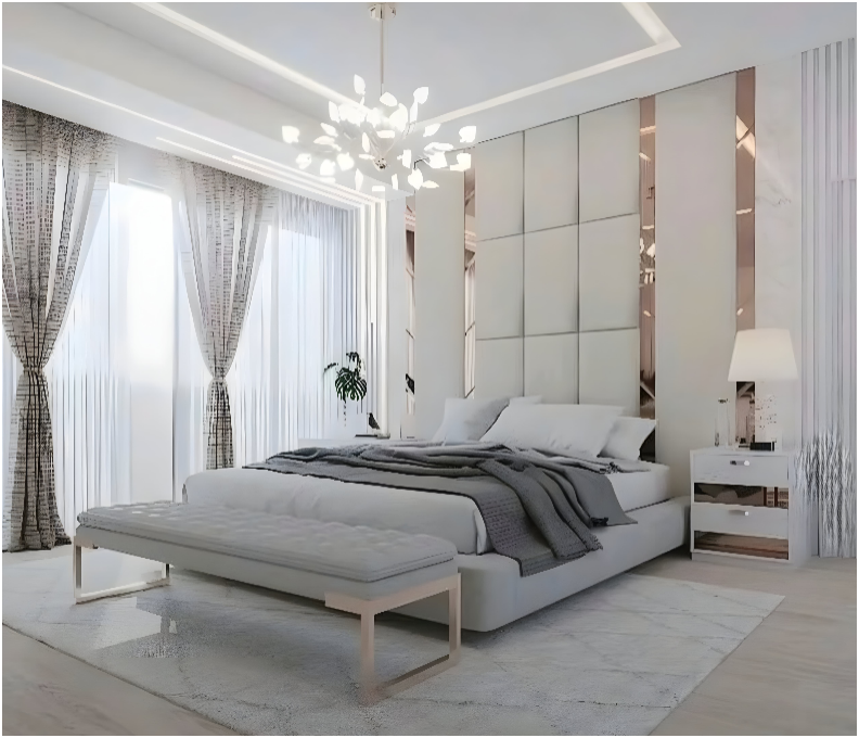 The image is of a bedroom with a white bed and a lamp. It showcases interior design elements such as pillows, bedding, curtains, and furniture. The room also features a nightstand and a window treatment.