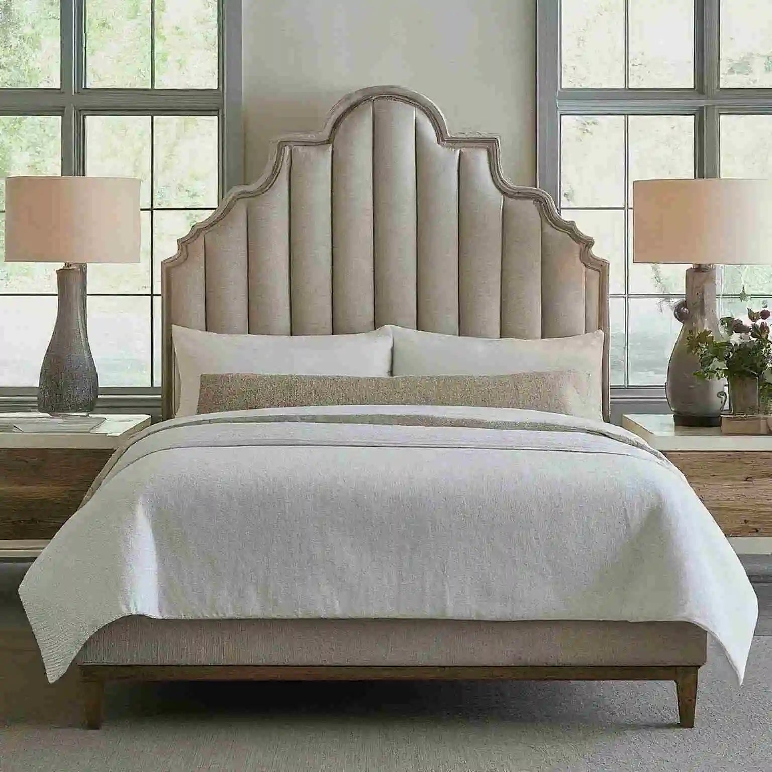 A sleek modern high headboard bed with clean panel lines and crown bed.