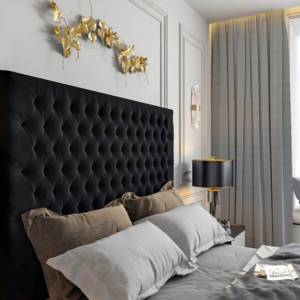 Luxurious bedroom featuring a black tufted Mini Chester TV Bed Frame, gold wall art, and a black lamp.