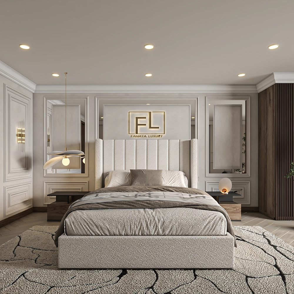 The image showcases The Manhattan Lined Wing Back Bed Frame in a stylish bedroom. The large bed features a tall, tufted light beige headboard with decorative pillows. A textured black and gray rug surrounds the bed, flanked by matching nightstands—one with an elegant pendant lamp and the other with a warm spherical lamp. The white paneled walls are complemented by large mirrors beside the headboard, and the "FL" logo with "FAMAYA LUXURY" is displayed above.