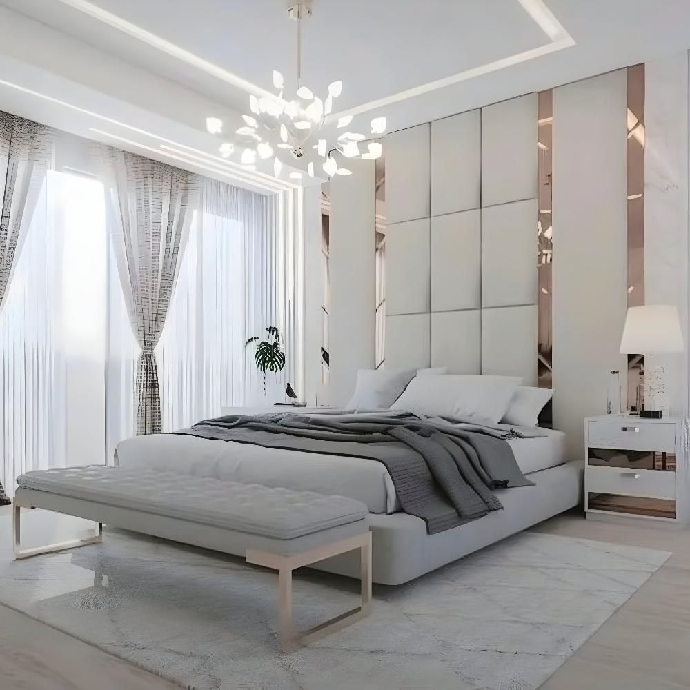 The Nexus Hybrid Bed adds elegance to this modern bedroom with its white frame, paired perfectly with a sleek bench. Large windows and a chandelier complete the sophisticated look.
