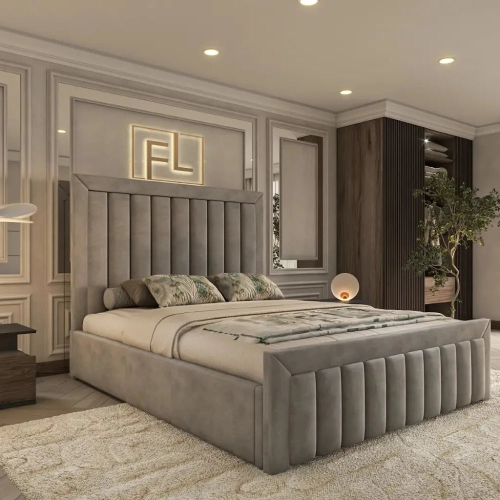 The Regency Bed Frame enhances this elegant modern bedroom, featuring a high, vertically-paneled gray headboard with plush bedding. A geometric panel wall with integrated lighting displaying "FL" adds sophistication, while vertical wood accents and a potted plant complete the look. Recessed spotlights illuminate the textured beige carpet, creating a warm ambiance.