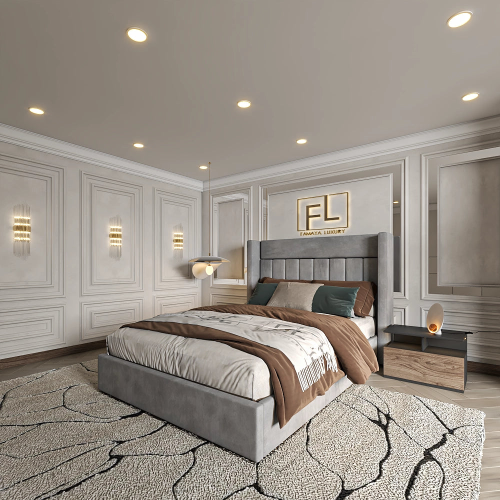 A luxurious bedroom with a Savoir Wing Back Bed, neutral bedding, lamps, and soft ambient lighting.