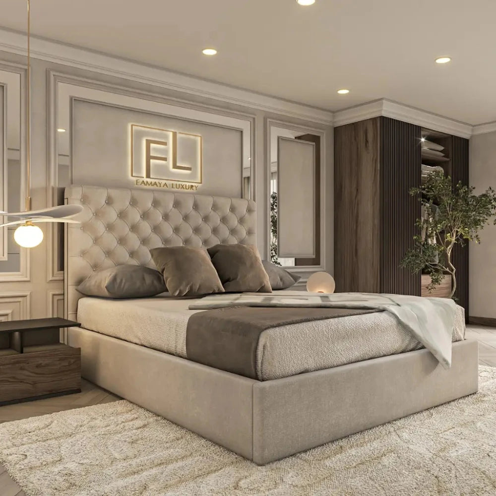 The image showcases a modern bedroom centered around a cream-colored, tufted bed with matching pillows and a gray throw blanket. Above the headboard is a backlit “FL” Famaya Luxury sign. A minimalist nightstand with a sculptural lamp sits to the left, while a corner wardrobe and potted plant complete the look—highlighting The Valencia Bed Frame.